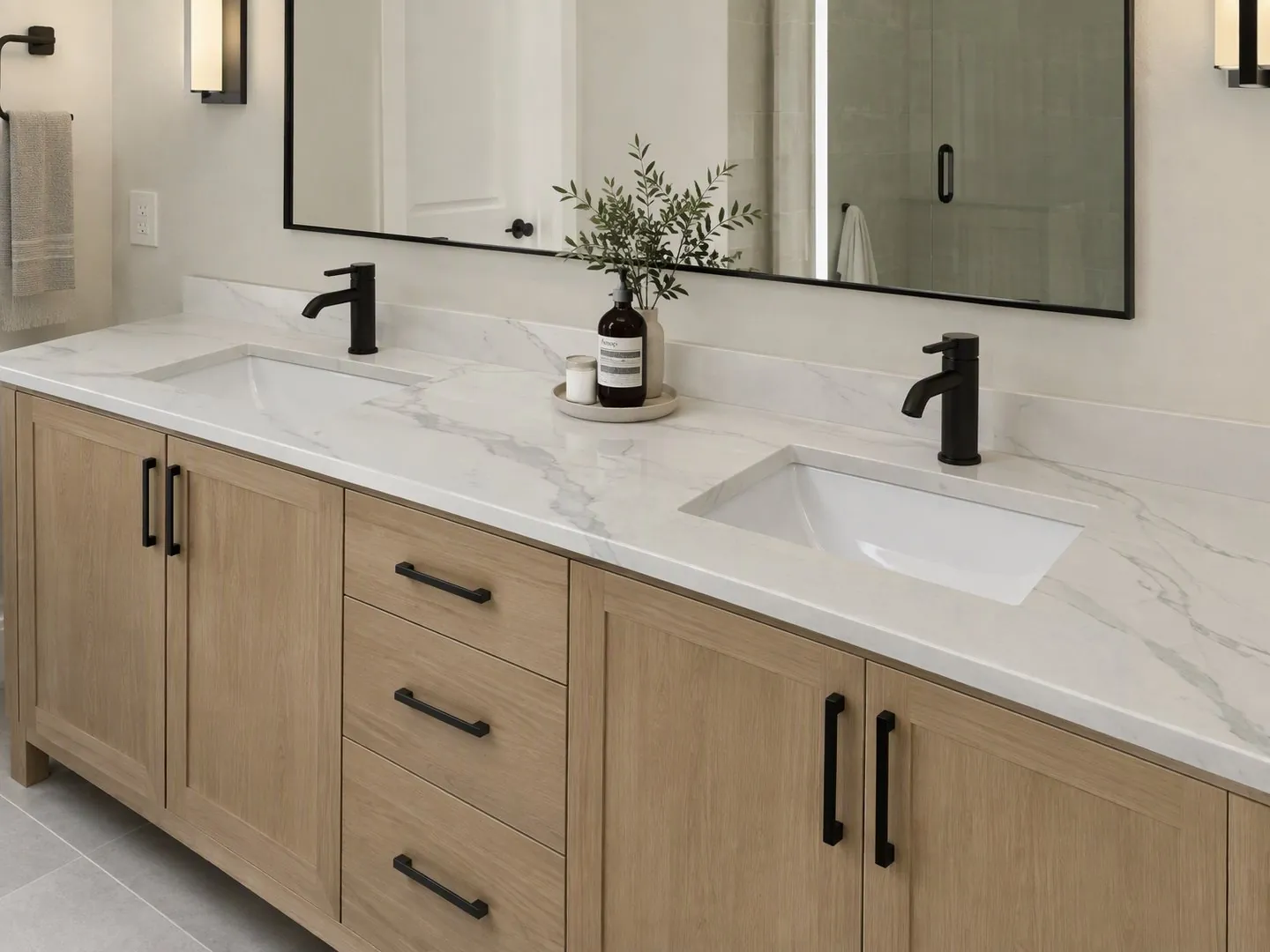 Render of a light wood double vanity with a white Impact Stratus-style veined quartz top and two black faucets